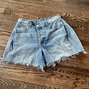Blue high-waisted denim raw hem distressed shorts asymmetrical button